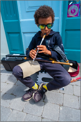 Domhnall playing whistle / Colm Keating